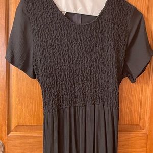 Black Maxi dress size 6p. attractive gathered bodice. Ties in back of waist.